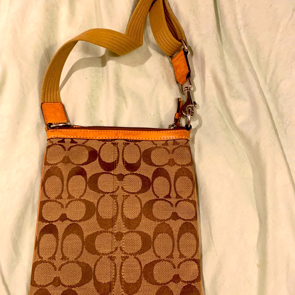 Really good condition funny , waist belted travel authentic Coach bag.Must have!